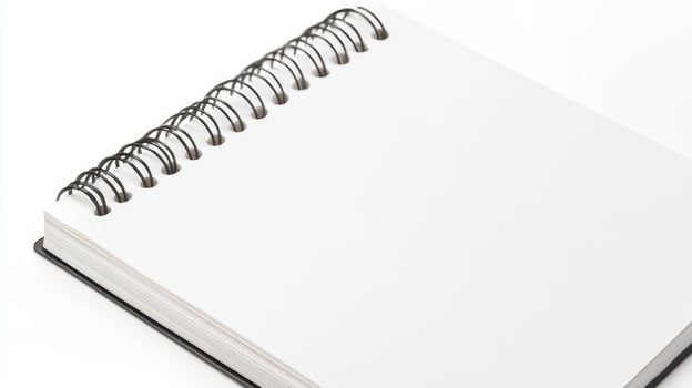 Blank spiral-bound notebook resting on a flat surface ready for sketches or notes photo