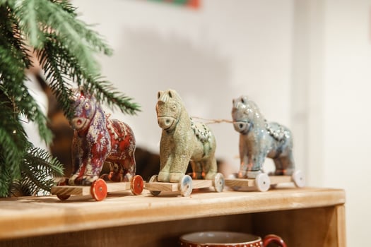 Sale of handmade ceramic Christmas tree toys at the Christmas Fair. Black Friday for the winter holidays. photo
