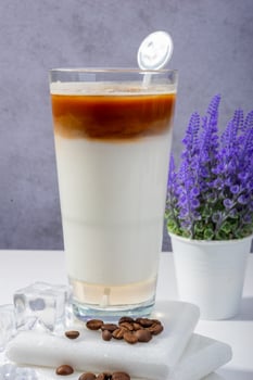 summer Coffee Latte with Milk Layers and Coffee Beans photo