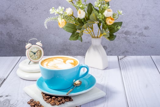 coffee beans, ground coffee, and a steaming mug of freshly brewed coffee photo