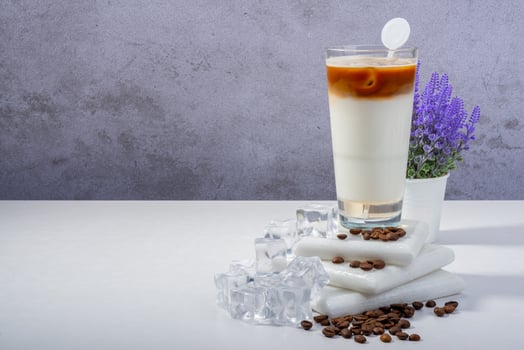 Iced Coffee Frappe with Whipped Cream and Floral Decor photo