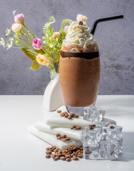 Elegant Latte with Coffee Beans and Vintage Clock on Wooden Table photo