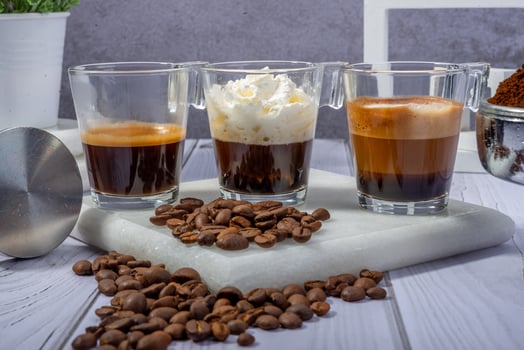 Elegant Latte with Coffee Beans and Vintage Clock on Wooden Table photo