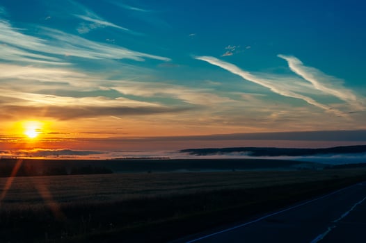 Sun Rising Above Asphalt Open Road In Sunny Sunrise Morning photo