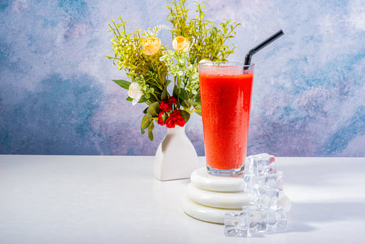 Icy Strawberry Smoothie with Ice and Floral Decor photo