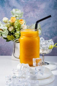 Fresh Mango Smoothie with Ice Cubes photo