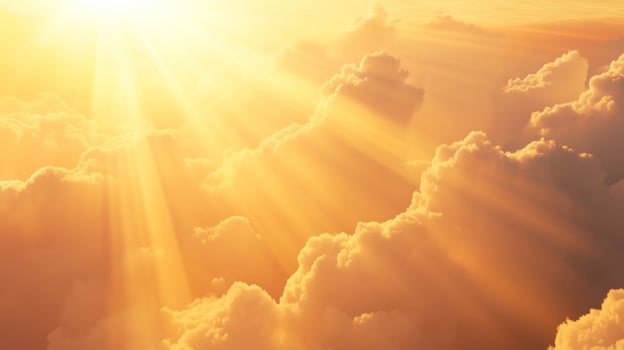 Bright orange-yellow sky at sunset with sunbeams and clouds photo