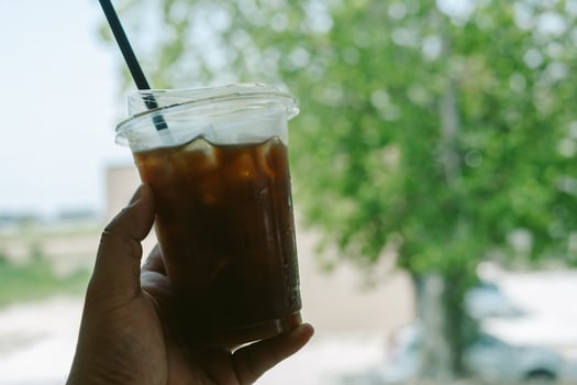 Ice black coffee in a disposable cup photo