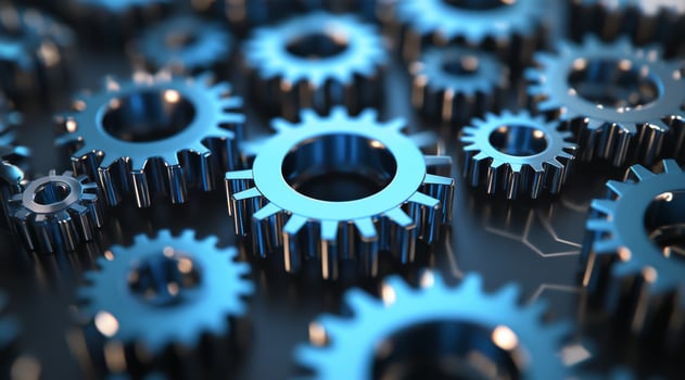A closeup highlights the intricately crafted blue metal gears interlocked, symbolizing teamwork and the precision of machinery in motion, showcasing their importance in industrial applications photo