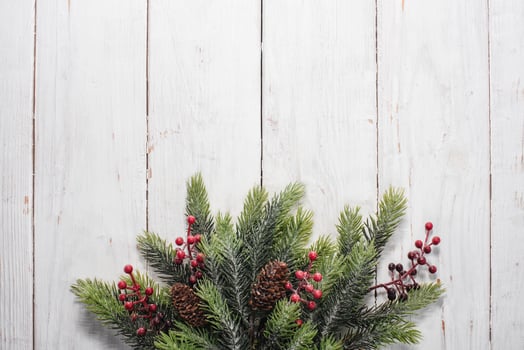 Christmas decorations on white wood background. Space for text. Top view. photo