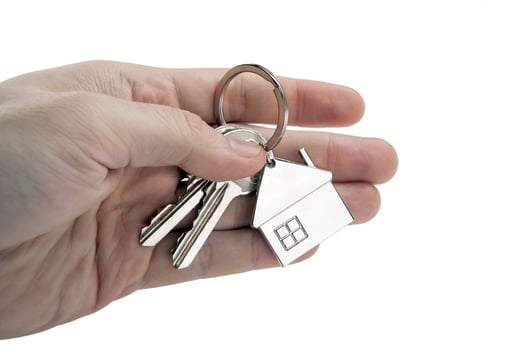 keys of an apartment in the palm of a person photo