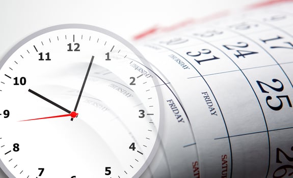 wall calendar with the number of days and clockface photo