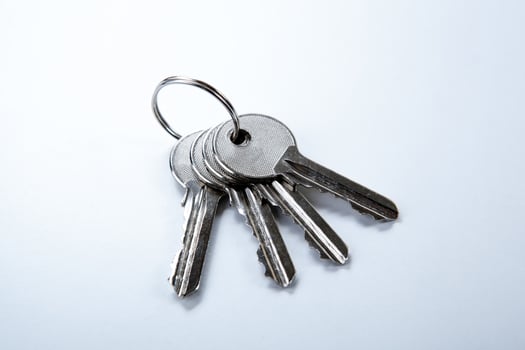 keys from the apartment on a white table photo