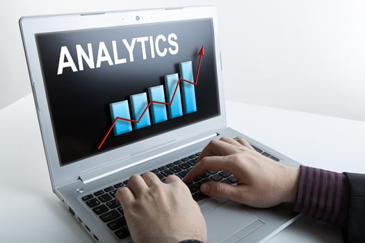 businessman working at a laptop analytics forecasting calculations photo