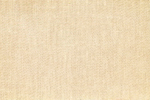 Natural Linen Material Textile Canvas Fabric Texture Background Close-up Detail of Fabric Natural Color Hemp Material Pattern Design Wallpaper. Can be Used as Background or For Graphic Design photo