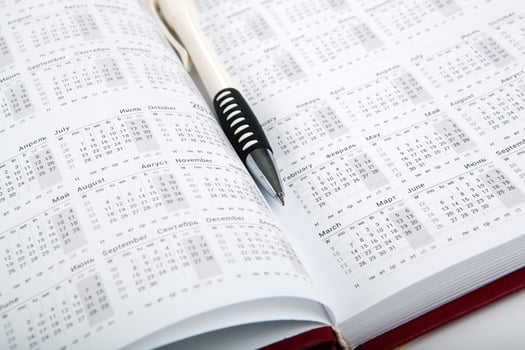 calendar days with numbers and pen photo