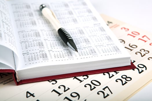 calendar days with numbers and pen photo