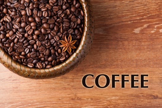 roasted coffee beans in a bamboo basket with title photo