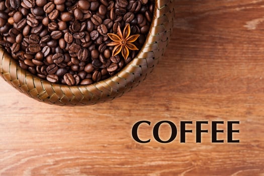 roasted coffee beans in a bamboo basket with title photo