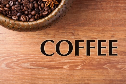 roasted coffee beans in a bamboo basket with title photo