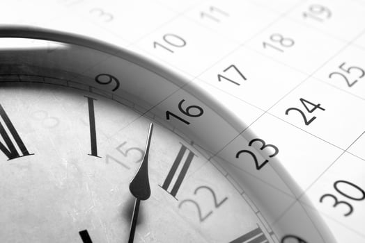 sheet of a calendar with the number of days and clock photo