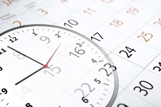 sheet of a calendar with the number of days and clock photo