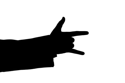 man's hand indicates horns black photo
