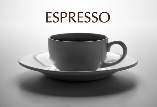 glass cup and saucer closeup with title espresso photo