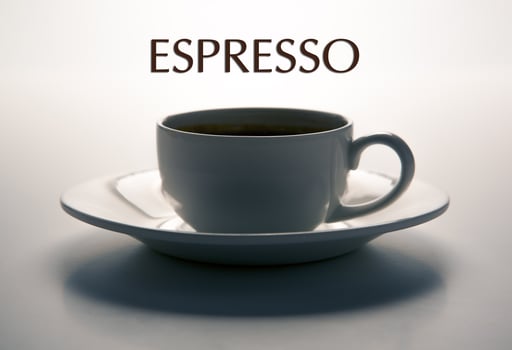 glass cup and saucer closeup with title espresso photo