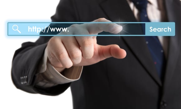 man's hand clicks on the address bar photo