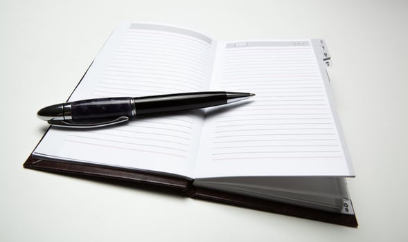 business diary with pen photo