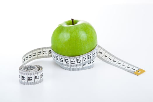 green apple with a ruler photo