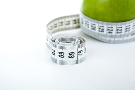 green apple with a ruler photo