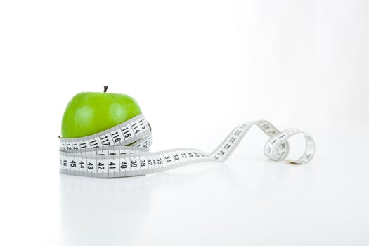 green apple with a ruler photo
