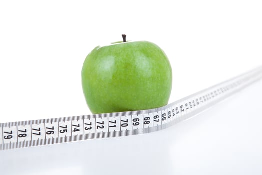 green apple with a ruler photo
