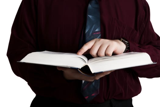 man holding an open book photo