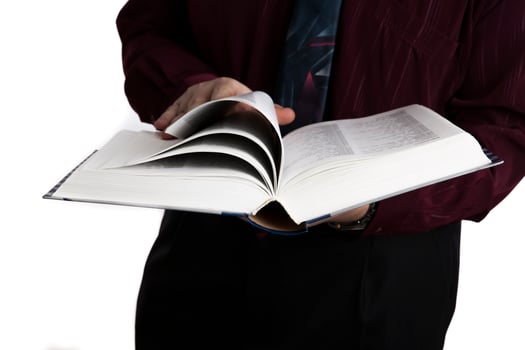 man holding an open book photo