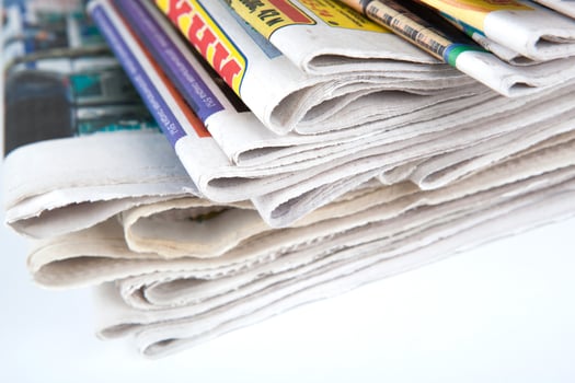 stack of newspapers close-up photo