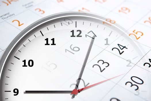 sheet of a calendar with the number of days and clock photo