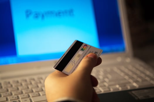 Credit card in hand when you pay photo