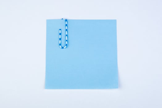 sheet of paper witn paper clip photo