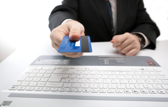 Credit card in hand when you pay photo