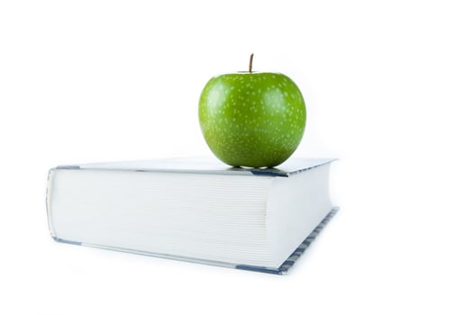 large book with green apple photo