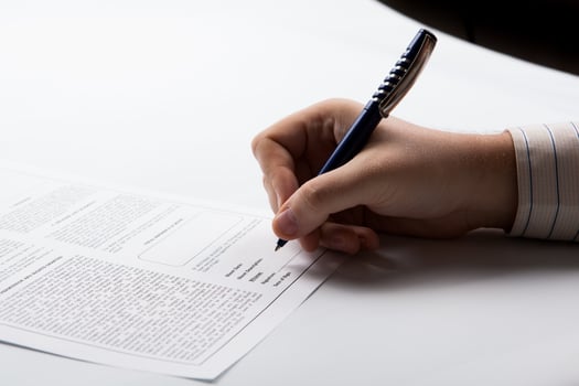 man signing a contract photo