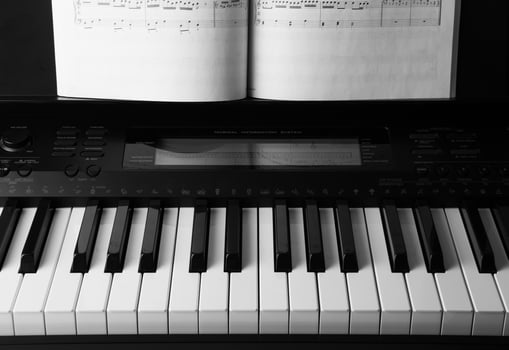 Piano keys and musical book photo