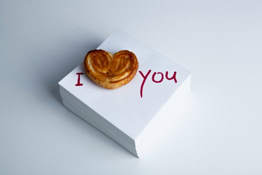 notebook with marker inscription I love you and biscuit photo