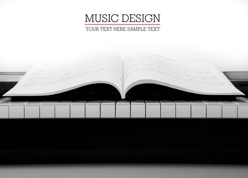 Piano keys and musical book photo