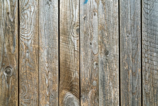 Old wood vintage planks covered with flaky brown paint. photo