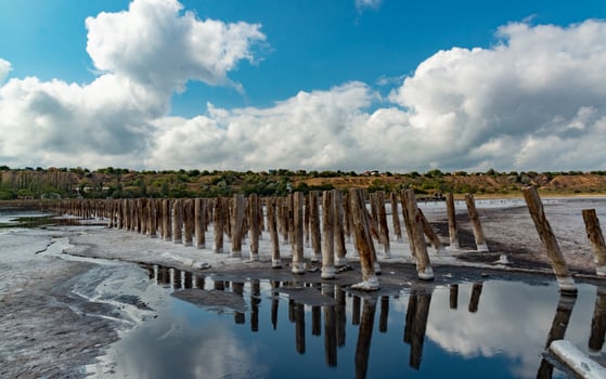 Salt crystals on wooden pillars of an old 18th century salt industry. The ecological problem is drought. photo