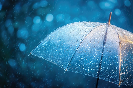 Transparent umbrella getting wet on a rainy evening in the city photo